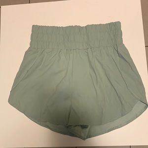 High waisted sage green running shorts